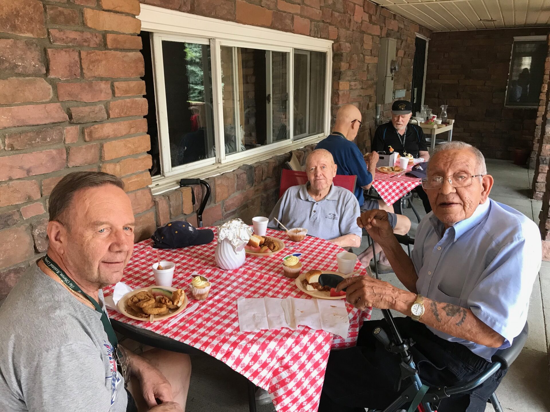 Seniors Enjoying A Communal Meal Together