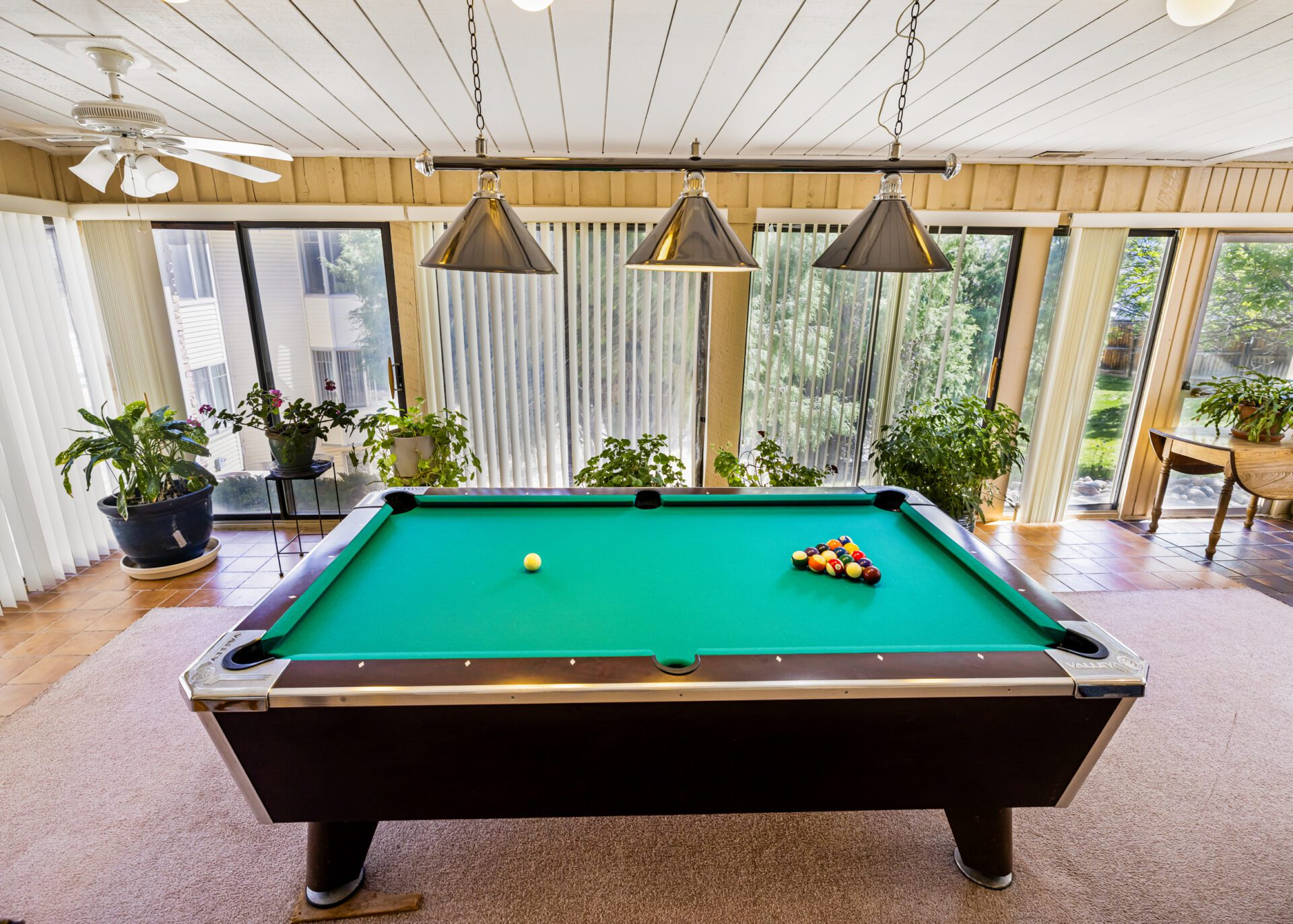 Game Room Featuring A Pool Table And Board Games