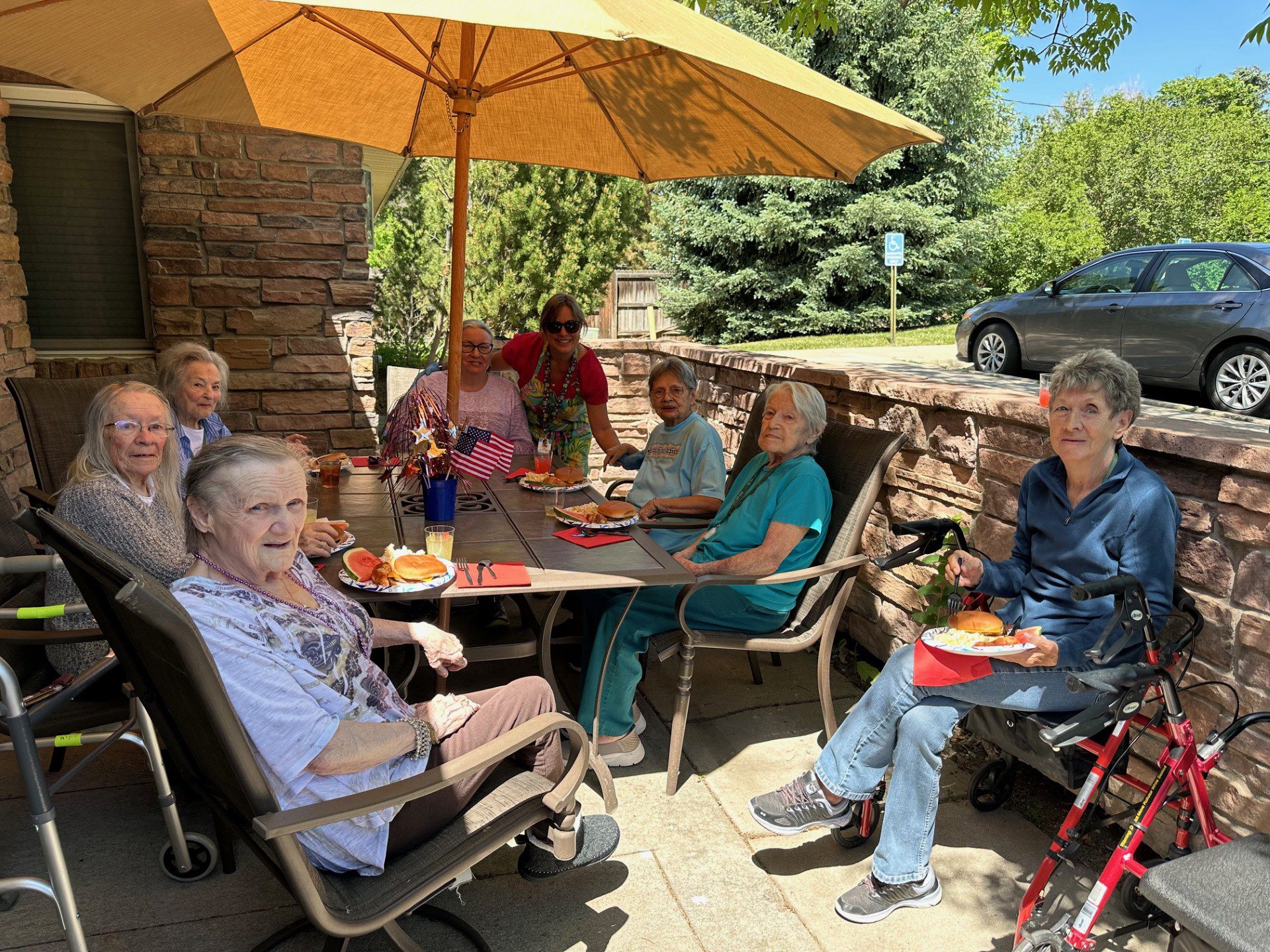 Outdoor Barbecue Event With Residents And Families